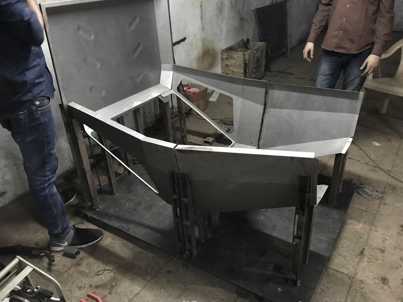 Folded cab panels staged on a stand for assembly movement
