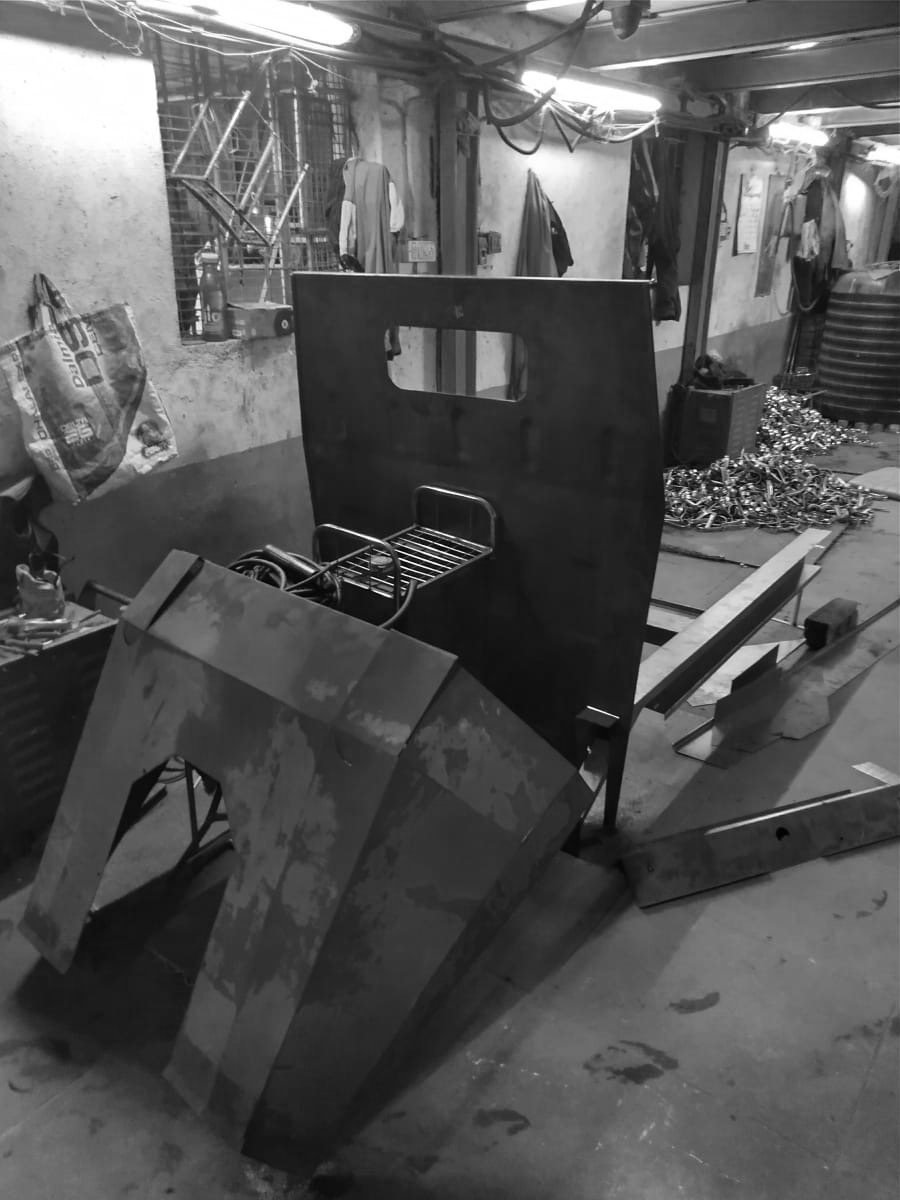 Black-and-white photo of the folded panel kit stacked as parts