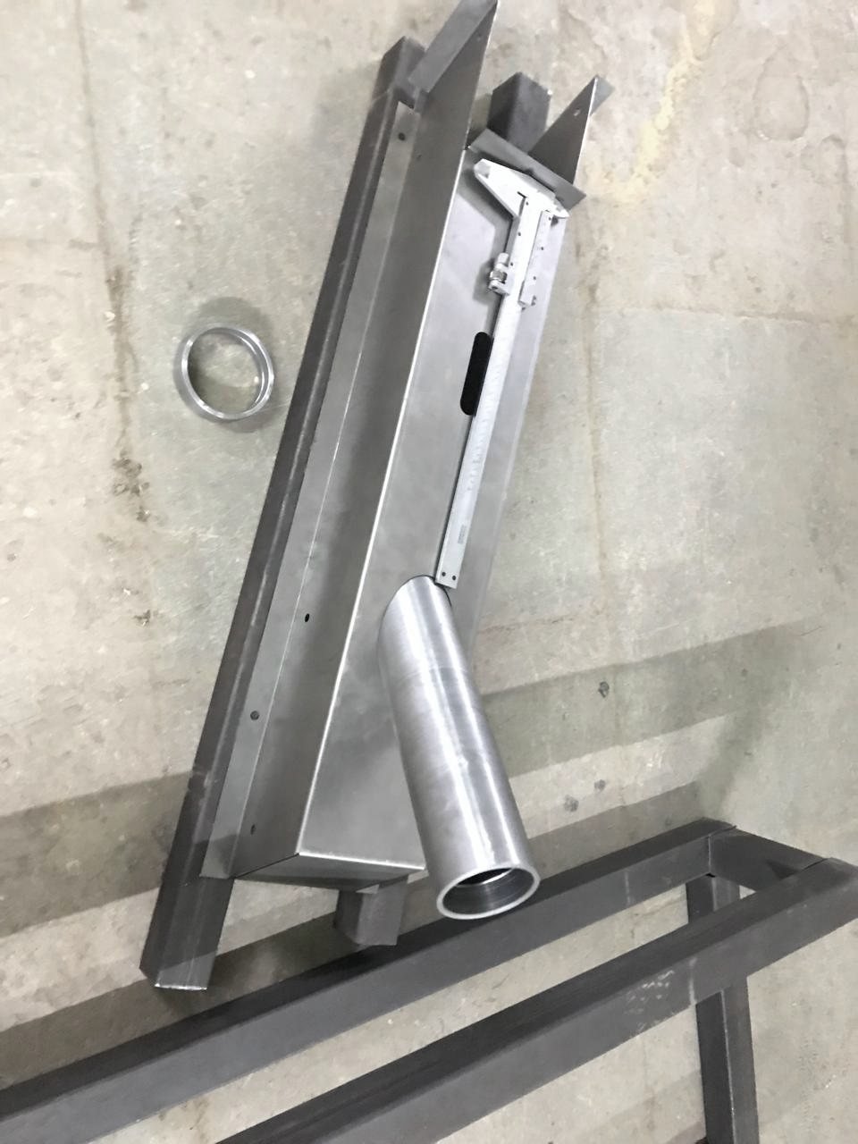 A welding fixture holding the steering-column subassembly