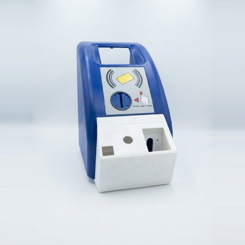 Mumbai Monorail ticketing unit: a blue reader head over a white body with a coin slot and tray