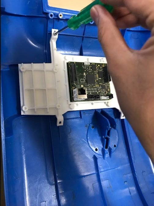 Screwing the module in place