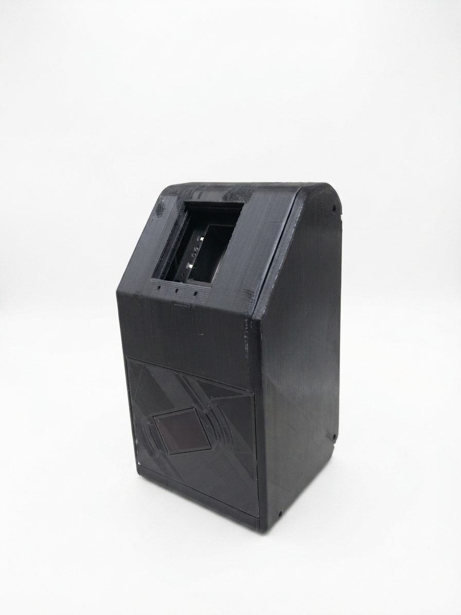 The assembled black card-reader device standing upright