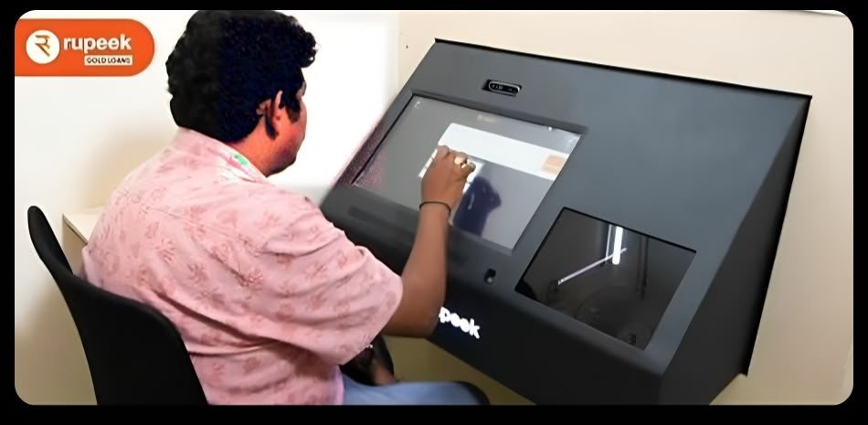 A Rupeek tester using the black Gold Teller Machine kiosk