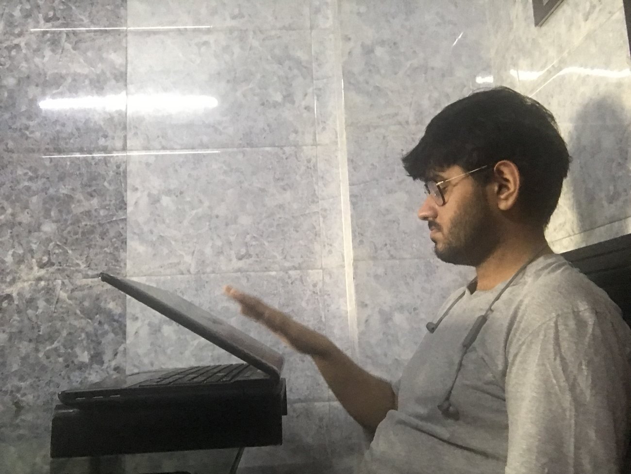 A participant testing the 30-degree screen mock-up mounted at counter height